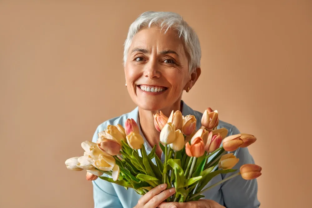 Woman in her early forties looking thoughtful in soft natural light