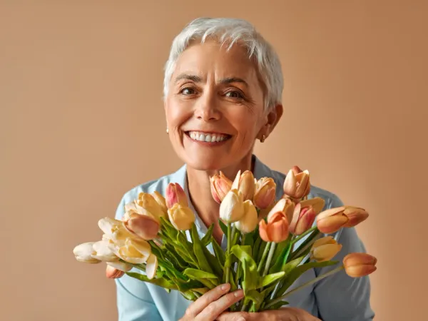 Woman in her early forties looking thoughtful in soft natural light