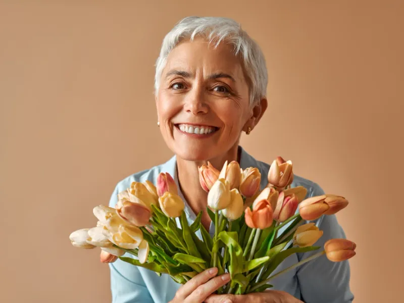 Woman in her early forties looking thoughtful in soft natural light